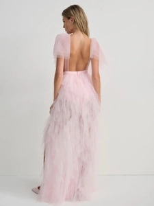 Detailed back view of pink mesh dress with tiered ruffles and elegant backless design
