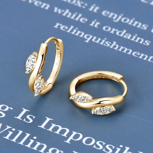 Macro detail of S925 sterling silver gold leaf earrings with Moissanite stones and hallmark