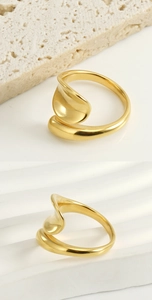 Detailed view of irregular 18k gold plated stainless steel ring with polished finish