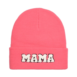 Detail of pink knitted beanie with white MAMA chenille embroidery on a plain background