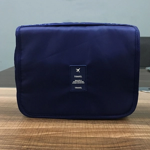 Hanging travel toiletry bag in navy blue with waterproof dry and wet separation design