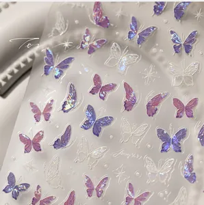 Macro detail of laser 5D butterfly nail art stickers with aurora iridescent finish