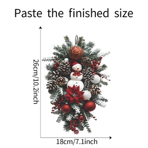 Christmas swag decoration with snowman and pinecones measuring 26cm tall by 18cm wide