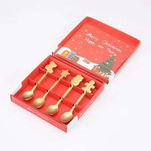 Golden Christmas spoon set in a festive red gift box featuring 4 unique holiday designs