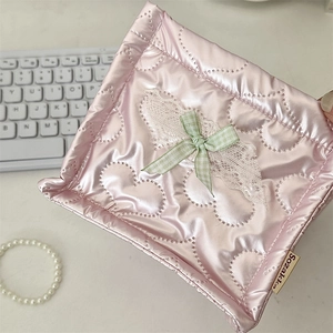 Detailed view of pink quilted PU storage basket on desk with keyboard and accessories