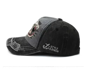 Side view of retro washed canvas baseball cap with anchor embroidery and shark patch