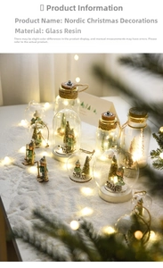 Macro detail of Nordic glass snow globe with XMAS resin base and warm LED lights