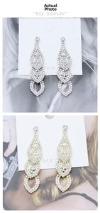 Detailed view of layered rhinestone drop earrings with S925 posts in gold and silver