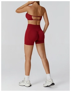 Close-up of seamless dark red yoga shorts with high waist and ruched butt lifting detail