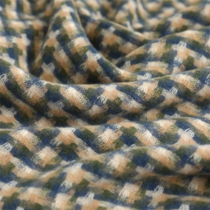 Close-up of thick plaid fabric texture in blue green and beige scarf material