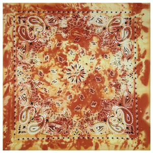 Detail of orange and yellow tie-dye bandana with classic paisley cashew flower pattern