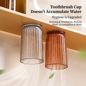 Magnetic upside-down toothbrush holder set with two striped wall-mounted draining cups