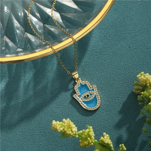 18K gold plated Hamsa Hand necklace with blue enamel and sparkling cubic zirconia stones