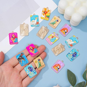 Colorful enamel tarot card charms including The Sun and Magician for DIY jewelry making