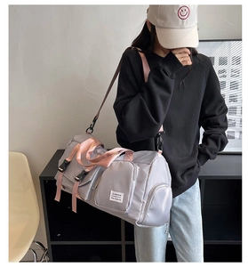 Travel fitness bag in light grey purple with pink straps and built-in shoe compartment