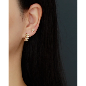 S925 sterling silver gold earrings set with sparkling zircon stones on female model