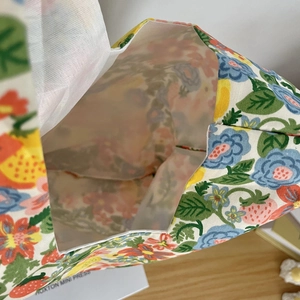 Internal view of floral cotton canvas wristlet bag with strawberry pattern lining
