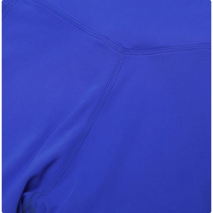 Close-up of royal blue high-waisted yoga shorts with reinforced flat-lock stitching detail