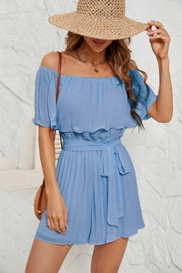 Detail of light blue off-shoulder chiffon jumpsuit with waist tie for summer resort style