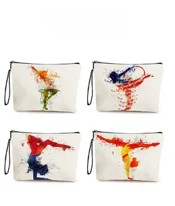 Detail view of four canvas makeup bags with colorful artistic silhouettes and black zippers