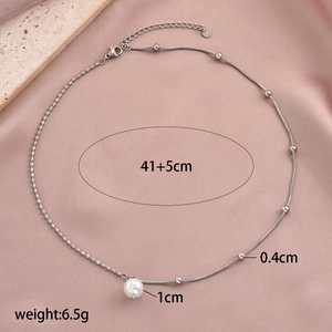 Elegant pearl pendant necklace in stainless steel with bead chain and satin background