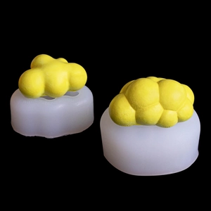 3D cloud shaped silicone mold for DIY candles and soaps with matte yellow finished product