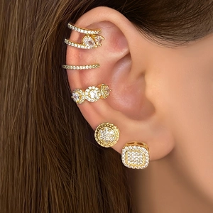 Macro shot of 18k gold plated square stud earrings with micro-paved sparkling cubic zirconia