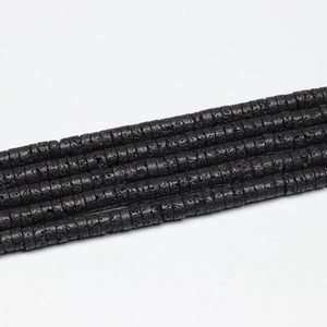 Macro shot of natural black volcanic lava stone spacer beads for DIY jewelry making