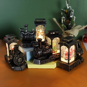 Set of 5 vintage train Christmas snow globes with festive figurines and glowing lights