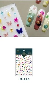 Macro shot of 3D cartoon nail stickers M-112 with colorful stars and moons patterns