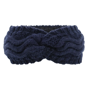 Close-up of navy blue cable-knit headband with twist knot and thick wool texture