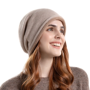 Beige oversized knitted slouchy beanie for women made of warm wool blend material