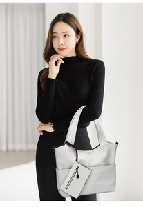 Detailed view of silver elephant texture tote bag with a matching small zipper pouch
