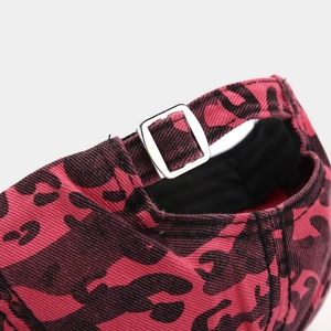 Close-up of the adjustable silver metal buckle on the pink leopard print cotton baseball cap