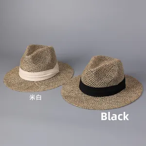 Close-up of breathable hollow weave straw hat detailing with cream and black ribbons