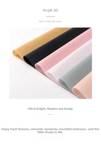 Detailed view of multi-color pearlescent tissue paper rolls for floral gift wrapping