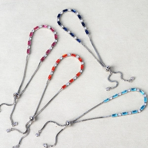 Colorful zircon crystal bracelets with adjustable clasps in pink, blue, and red colors