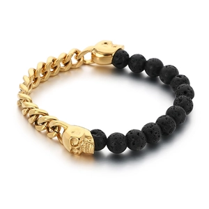 Men's skull beaded bracelet with gold cuban chain and black volcanic stones on white background