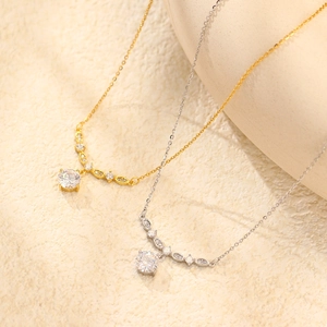 Elegant s925 silver zircon necklaces in gold and silver finishes on textured background