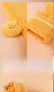 Detail of elegant shawl collar and soft fleece texture on yellow winter bathrobe