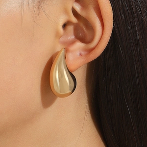 Polished gold teardrop earrings for women featuring a minimalist mirror-finish surface