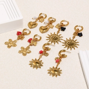 Golden earring set featuring sun, heart, and flower charms with colorful bead accents