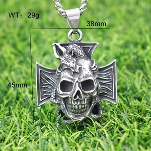 Detailed view of skull and scorpion pendant with weight and size measurements