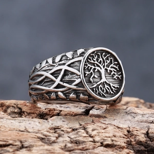 Macro detail of Tree of Life engraving on oxidized silver style stainless steel ring