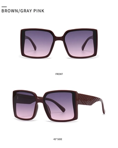 Detail view of square sunglasses with V-shaped geometric texture and gradient lenses