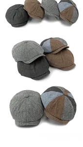 Close-up of vintage newsboy caps in tweed fabric showing stitching and texture details