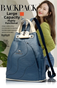 Detail of multi-functional dark blue bag with lychee texture and logo worn by model