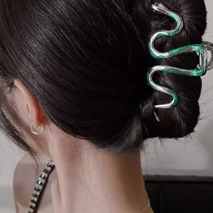 Elegant green snake metal hair claw clip for women back view hairstyle on model