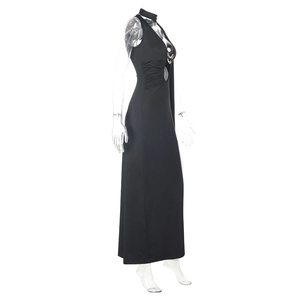 Detail of waist cutout with irregular metal buckle on a black backless maxi dress