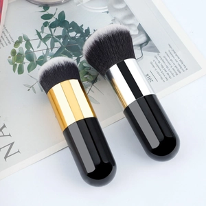 Black round foundation brush with gold and silver tubes and dual-tone synthetic bristles